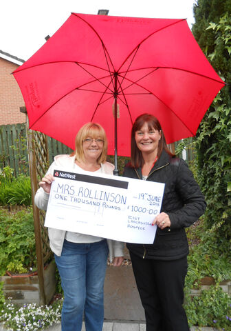 Latest lottery winner is singing in the rain!