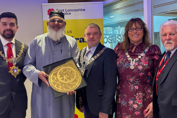 Suleman Khonat who has been volunteering for the Hospice, including our Ramadan appeal, with his award during our Iftar event.