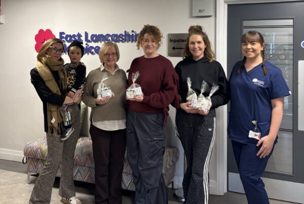 Kevin Andrews' family at East Lancashire Hospice with the packs their fundraised for and donated to the Hospice.